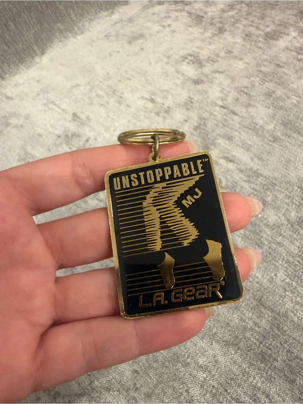 L.A. Gear Black and Gold 'Unstoppable' Rectangular Keychain